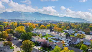Aerial perspective of suburban area with a mountain backdrop