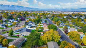 Aerial perspective of suburban area featuring a mountain backdrop