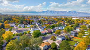 Aerial perspective of suburban area with a mountain backdrop