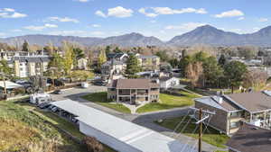 Aerial view of residential area featuring a mountainous background