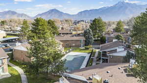 Aerial perspective of suburban area featuring a mountain backdrop
