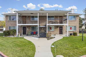 View of property with stairs