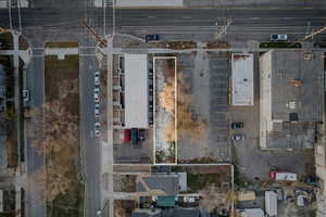 Aerial view of property and surrounding area with property parcel outlined