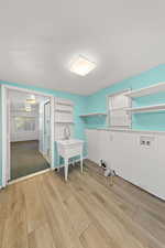 Laundry area featuring light wood-style floors and hookup for a washing machine