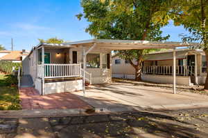 Manufactured / mobile home with an attached carport and driveway