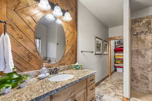 Bathroom featuring vanity and baseboards