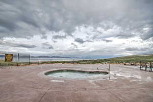 View of pool featuring a community hot tub