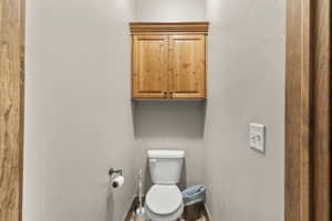 Bathroom featuring toilet and baseboards