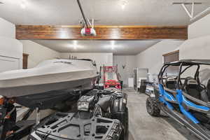 Garage featuring a garage door opener
