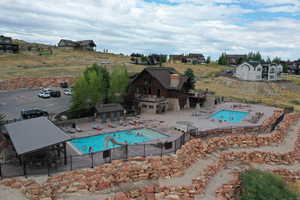 Community pool with a patio