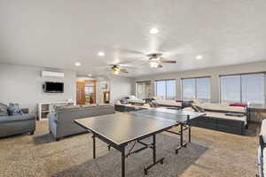 Playroom with recessed lighting, carpet, a ceiling fan, and a textured ceiling