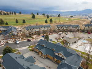 Aerial perspective of suburban area with a mountainous background