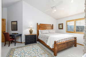 Bedroom featuring lofted ceiling, carpet, and ceiling fan