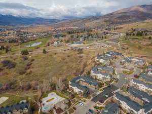 View of property location with nearby suburban area and a water and mountain view