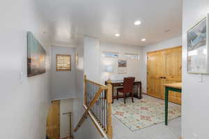 Office area featuring light carpet and recessed lighting