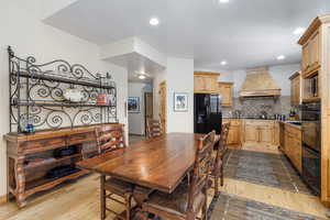 Dining space featuring light wood-style floors and recessed lighting