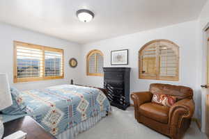 Bedroom with carpet flooring and baseboards