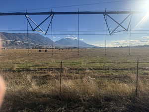 View of mountain backdrop featuring rural landscape