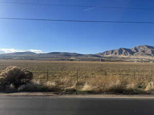 View of mountain background featuring rural landscape