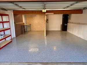 View of garage and solar backup battery (2 days of power) & epoxy floors