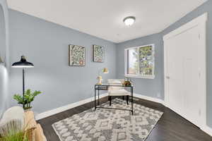Office featuring baseboards and dark wood-style floors