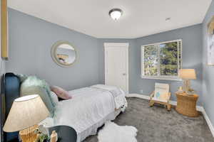 Bedroom with carpet floors and baseboards