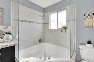 Full bathroom featuring tub / shower combination and vanity