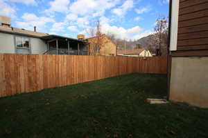Fenced backyard with a mountain view