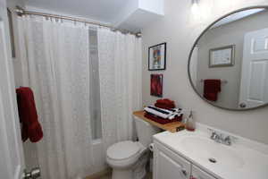 Full bathroom with vanity and shower / tub combo with curtain