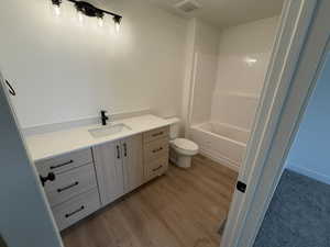 Bathroom featuring vanity and light wood finished floors