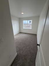 Spare room with carpet and a textured ceiling