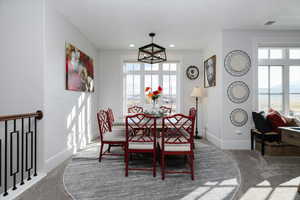 Dining area featuring carpet flooring and recessed lighting