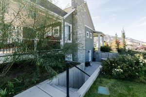 View of side of property featuring a chimney