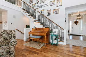 Entryway featuring hardwood / wood-style floors and stairs