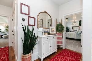 Hall with dark wood-style floors