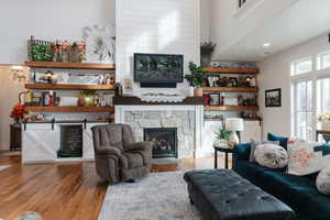 Living area featuring hardwood / wood-style floors and a fireplace