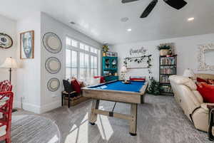 Game room with carpet and billiards table