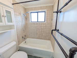 Full bathroom featuring bathtub / shower combination and toilet