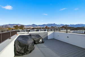 Wooden deck featuring a mountain view