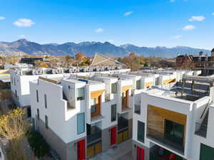 View of property with a residential view and a mountain view