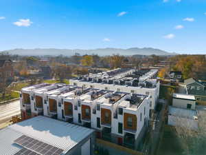 Aerial view of residential area featuring a mountainous background