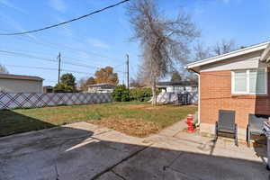 View of yard with a patio