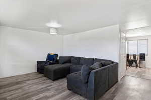 Living area featuring wood finished floors and baseboards