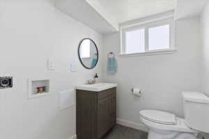 Bathroom featuring vanity and a textured ceiling