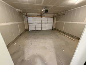 Garage featuring a garage door opener