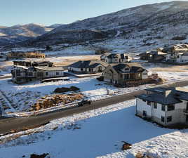 Snowy aerial view featuring a mountain view