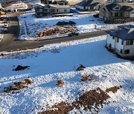 Snowy aerial view with a residential view