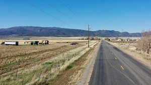View of mountain background featuring rural landscape