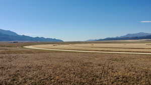 View of mountain background featuring rural landscape