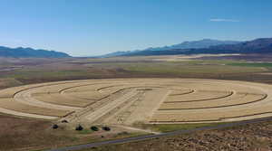 Overview of rural landscape featuring a mountainous background